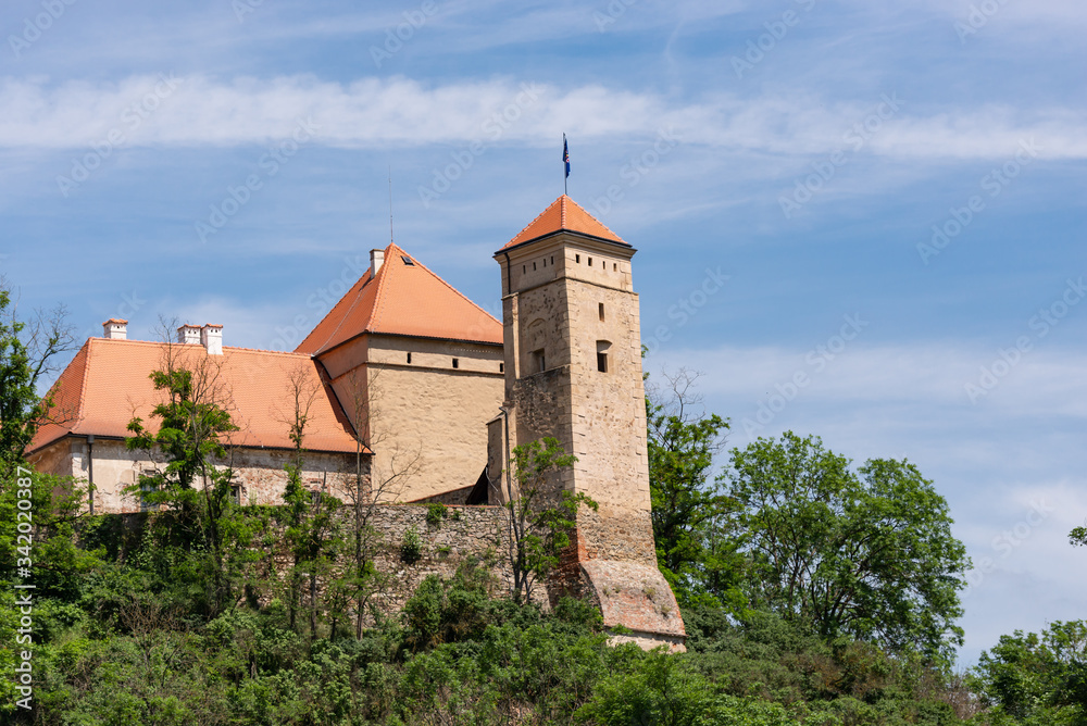 Veveri castle is located in the Czech Republic. Fortress walls and towers on the hill.