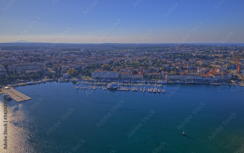 PULA, CROATIA - SEPTEMBER 13, 2019: Early morning aerial shoot of Pula harbor and marina with boats and sailboats, Adriatic tourist destination Pula, Croatia.