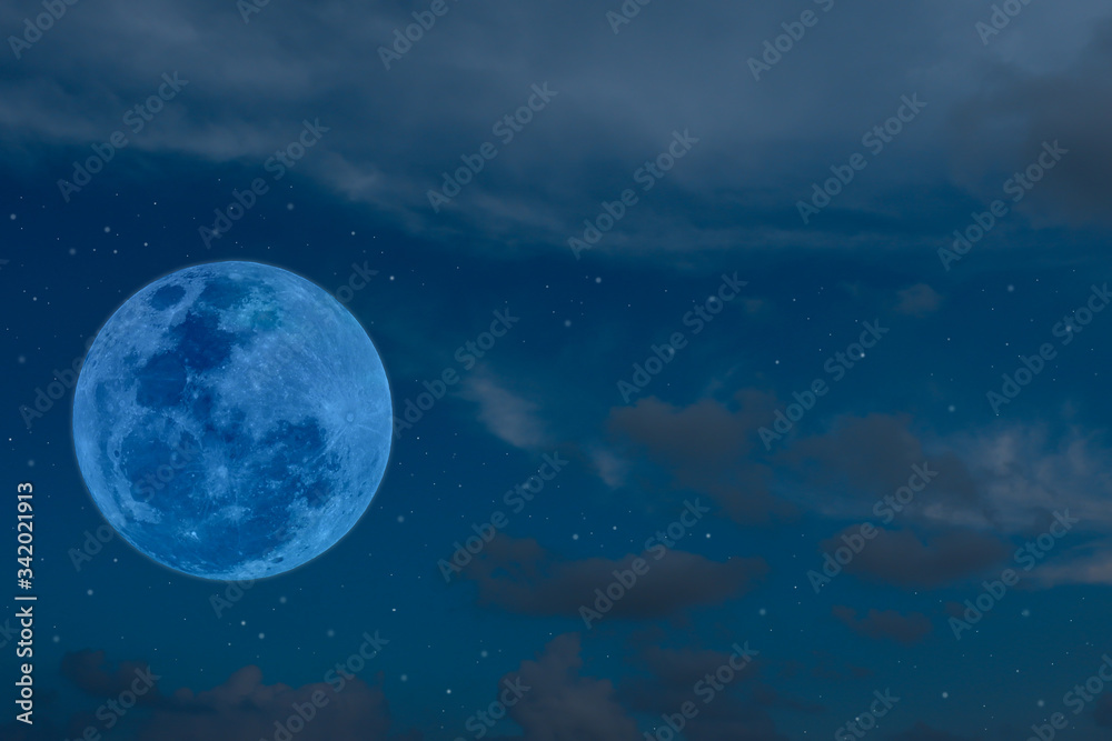 Blue full moon on the sky.
