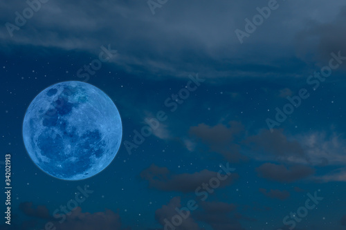 Blue full moon on the sky.