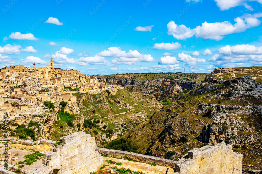 Scenic panoramic sunny summer view of Matera and the canyon of Matera in the Province of Matera, Basilicata Region, Italy