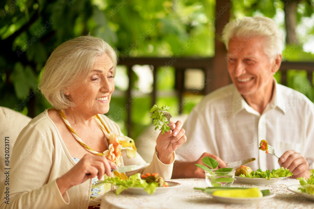 Portrait of happy senior couple having diner Portrait of happy senior couple having diner