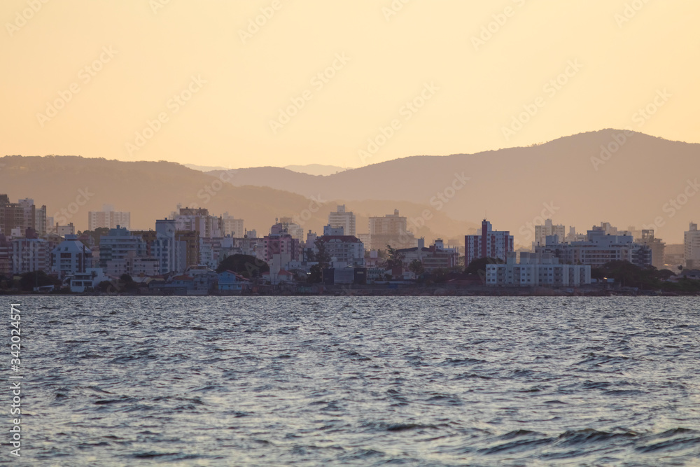 Row of buildings on the coast of Florianópolis at sunset, Santa Catarina, Brazil