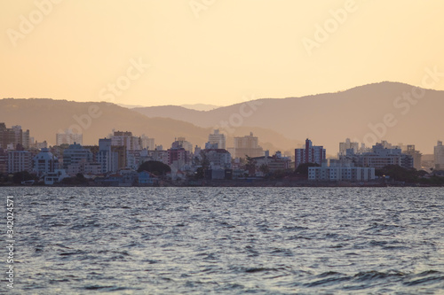 Row of buildings on the coast of Florianópolis at sunset, Santa Catarina, Brazil © Erich Sacco