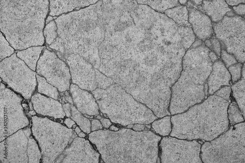 Cracked concrete floor texture background.
