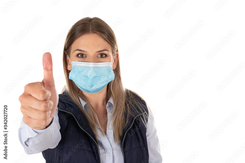 Woman with mask showing thumbs up Woman with mask showing thumbs up