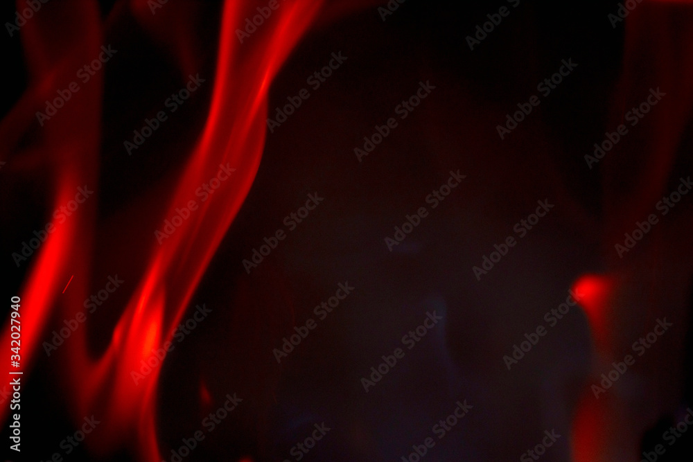 Beautiful fire flame on a black background. Blurry abstraction