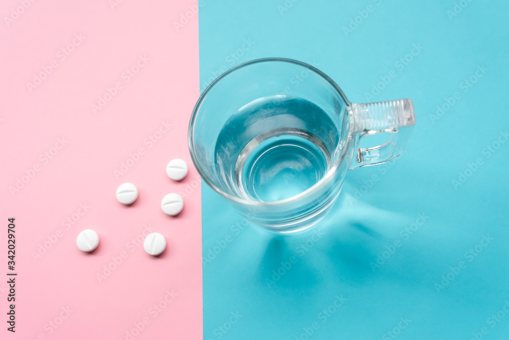 pills on turquoise and pink background for the prevention, immunization and treatment of coronavirus infection (new coronavirus disease 2019, COVID-19, nCoV 2019 from Wuhan). pills on turquoise and pink background for the prevention, immunization and treatment of coronavirus infection (new coronavirus disease 2019, COVID-19, nCoV 2019 from Wuhan).