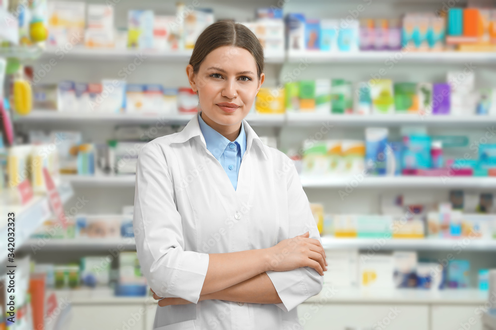 Portrait of professional pharmacist in modern drugstore