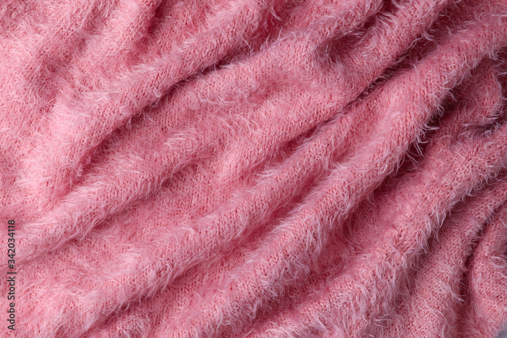 Fluffy pink fur, glamour fashion background. Fashionable rose colour fur fabric texture. Close up