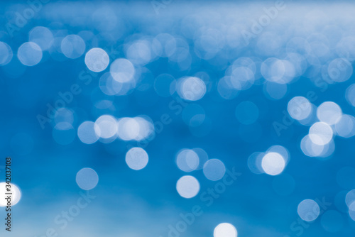 Bokeh of Blue water reflection With daylight during the day.soft focus.