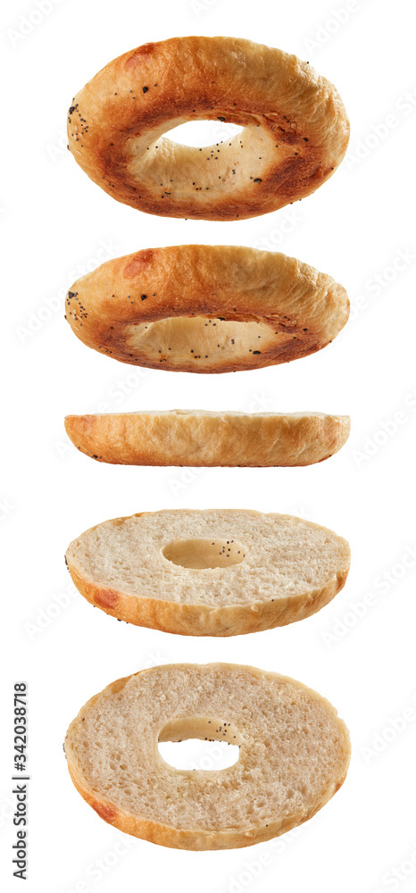 Fotografie Halved bagel bottoms flying on white background