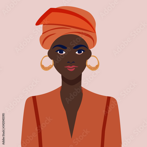 Portrait of a beautiful african woman with earring. Female portrait. Black beauty concept.