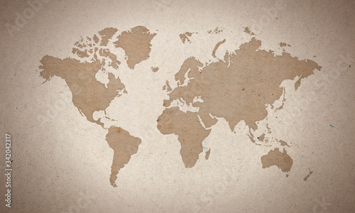 world map silhouete on old paper surface  #342042317