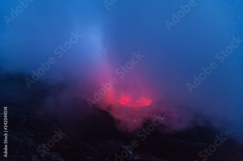 Smoke above the lava lake glowing red