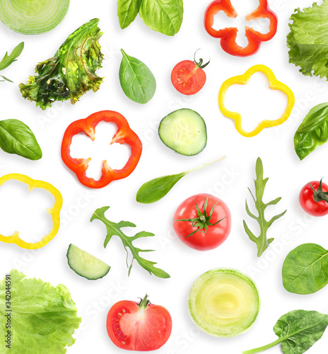 Set of different vegetables and herbs on white background, top view. Fresh ingredients for salad
