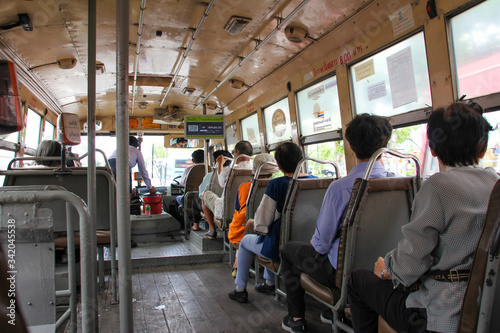 Interior of a Bangkok city bus with passengers