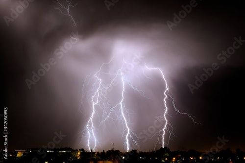 Wallpaper Mural Lightning strikes at night during a severe thunderstorm over the city of Mendoza, Argentina Torontodigital.ca