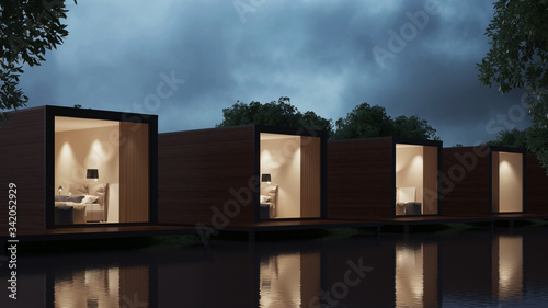 The hotel is not a river bank of transport containers. Night lighting. 3D rendering.