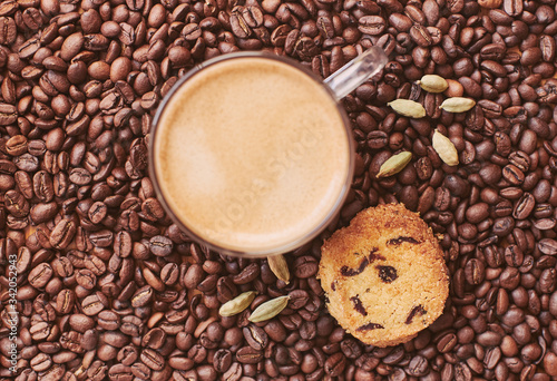 Roasted coffee beans, coffee mug, cookies © victorbabintsev