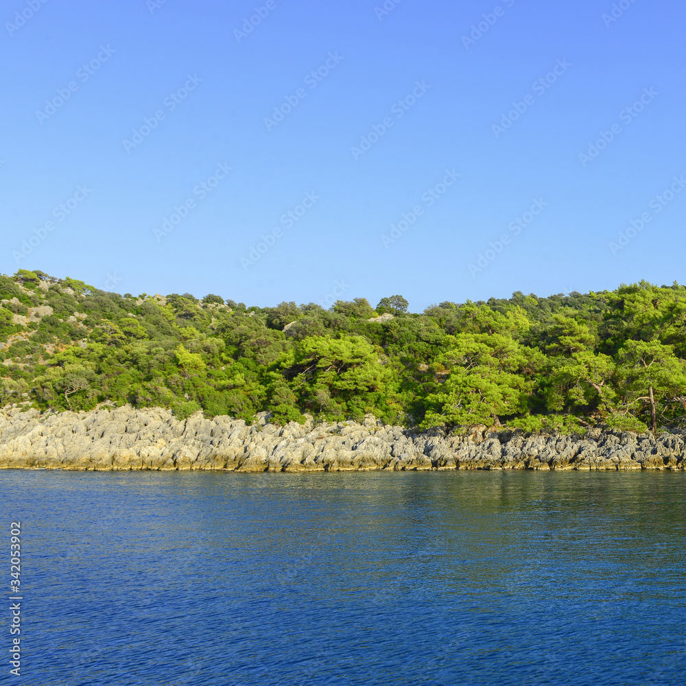 Diving boat anchored in a green bay. Fethiye, Turkey.
O
Diving boat anchored in a green bay. Fethiye, Turkey.
O