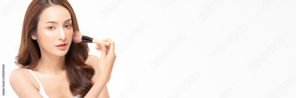 Banner beauty asian woman brown hair looking smile in camera happiness and hold make up brush and cheerful with make up brush,Beauty Concept on white background. Banner beauty asian woman brown hair looking smile in camera happiness and hold make up brush and cheerful with make up brush,Beauty Concept on white background.