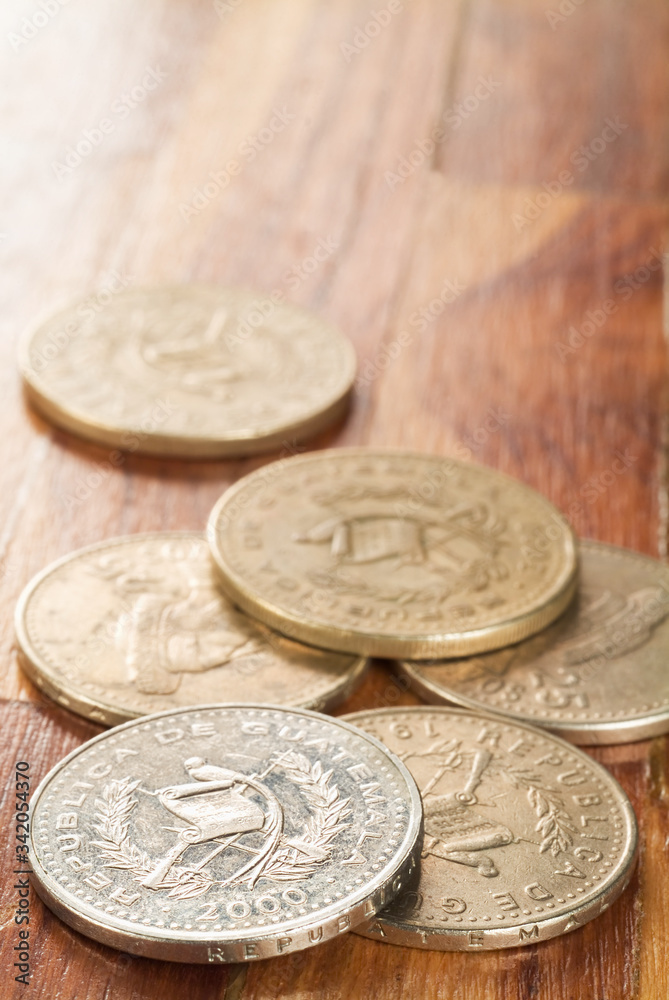 Some scattered Quetzal coins, the official currency of Guatemala. Some scattered Quetzal coins, the official currency of Guatemala.