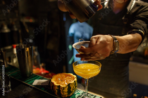 the bartender prepares a cocktail in the style of Halloween