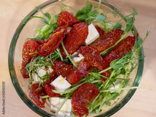 fresh salad with tomatoes and seedlings