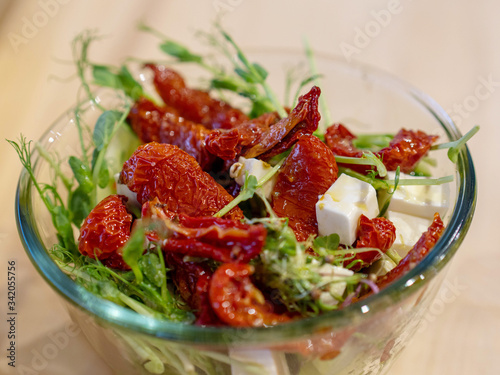 salad with tomatoes and micro green seedlings