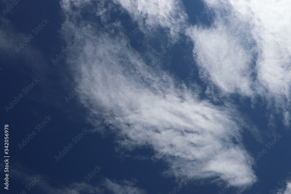 Unusual clouds on a background of blue sky Unusual clouds on a background of blue sky