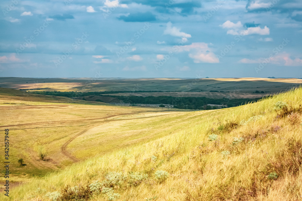 Summer or autumn yellow hills with dry grass. landscape and nature of Ukraine.