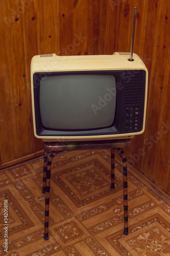 Retro soviet portable analog tv on stool
