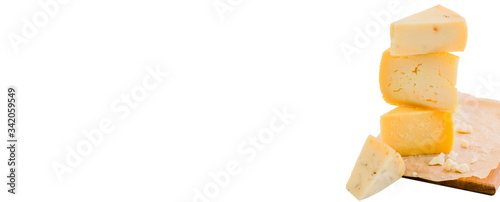 Stack of assorted cheeses isolated on white background, banner