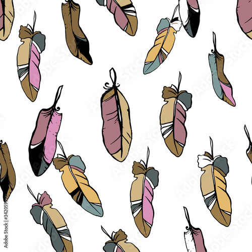 Vector seamless pattern with colored feathers