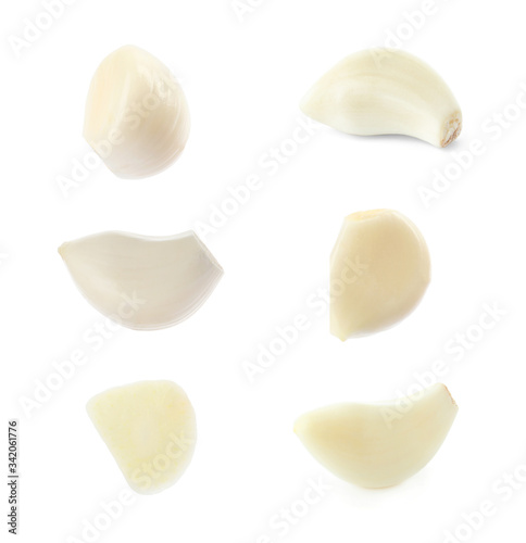 Set of peeled garlic cloves on white background