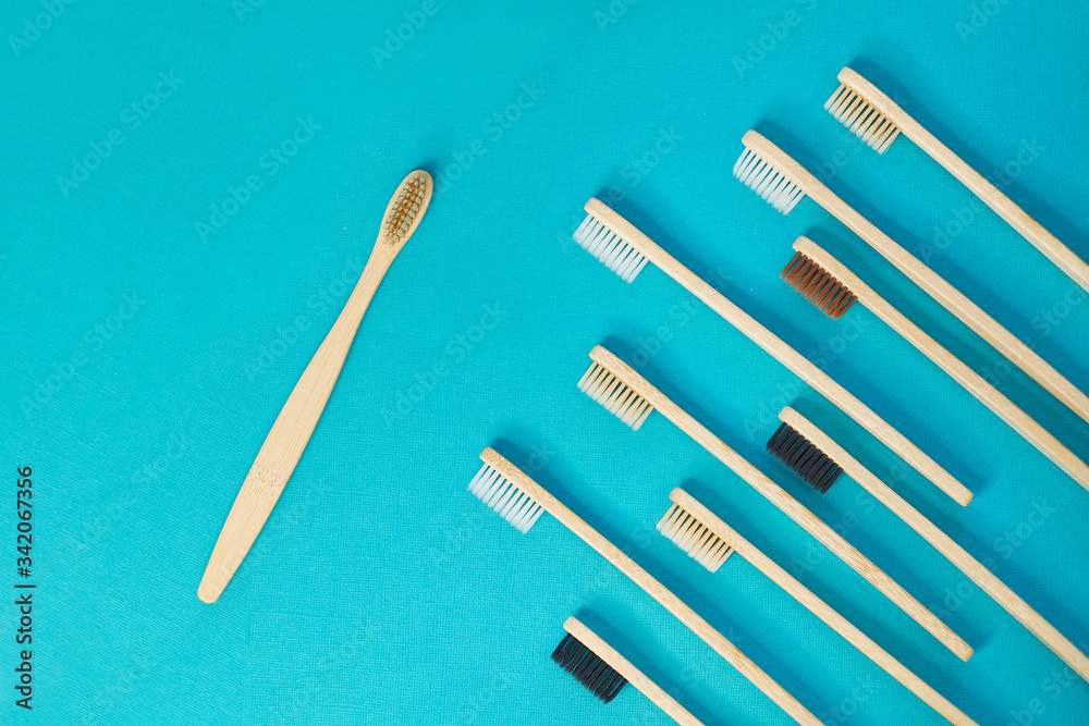 Wooden toothbrushes on a blue background. zero waste concept. dental care without platysik. Wooden toothbrushes on a blue background. zero waste concept. dental care without platysik.