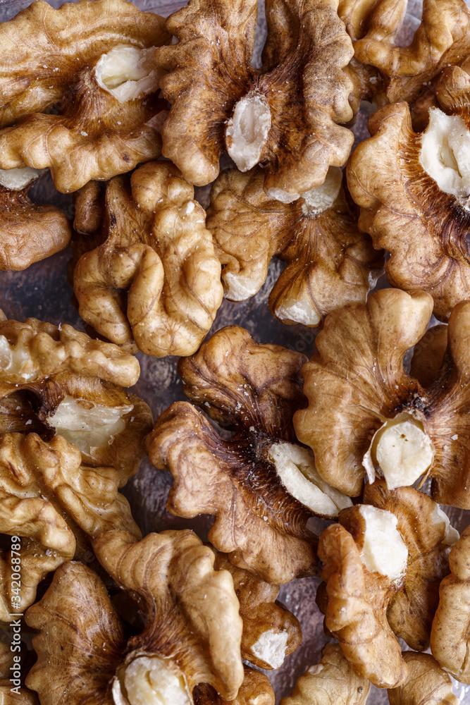 Peeled Raw Walnuts. Fresh organic Nuts. Raw nuts. Many delicious Walnuts as a food background. Peeled Raw Walnuts. Fresh organic Nuts. Raw nuts. Many delicious Walnuts as a food background.