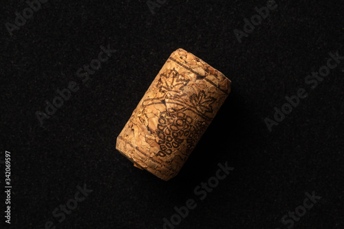 One cork stopper for wine bottle over black background