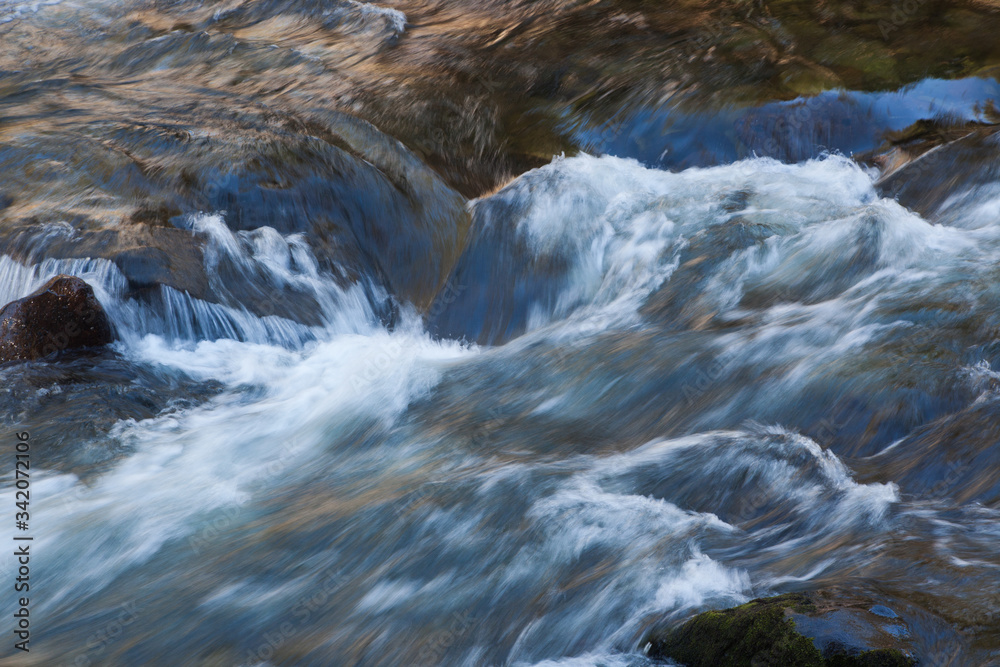 Water Cascading over rocks outdoors Water Cascading over rocks outdoors