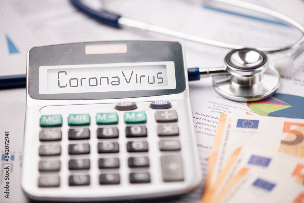 Coronavirus epidemic and its financial consequences. A calculator with the word CORONAVIRUS Coronavirus epidemic and its financial consequences. A calculator with the word CORONAVIRUS