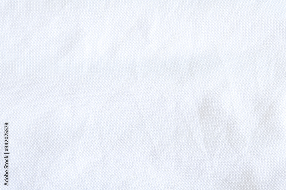 White fabric close up shot of Cotton and polyester shirt. Casual wear over the weekend or summer time season. Background texture concept with copy space for text. White fabric close up shot of Cotton and polyester shirt. Casual wear over the weekend or summer time season. Background texture concept with copy space for text.