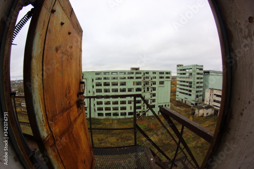 a complex of abandoned industrial buildings in the middle of the forest