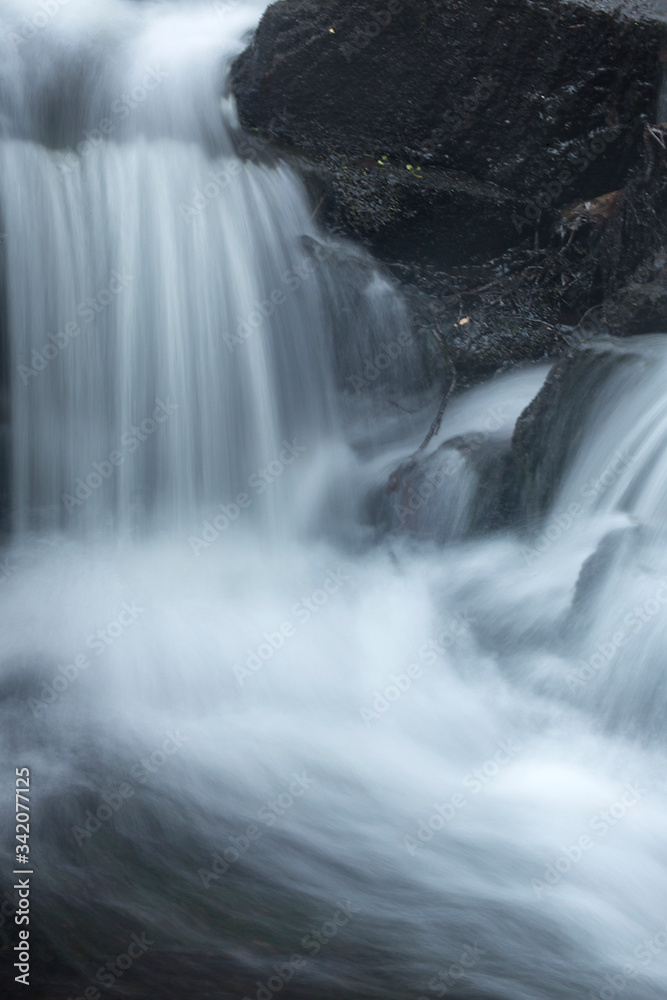 Silky, turbulent water of a small waterfall in Hebron, Connecticut. Silky, turbulent water of a small waterfall in Hebron, Connecticut.