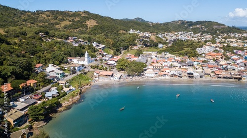 Fototapeta Naklejka Na Ścianę i Meble -  Aerial view of the city and beach of Garopaba, in Santa Catarina, Brazil