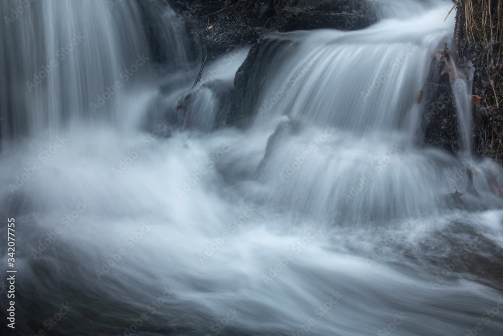 Silky, turbulent water of a small waterfall in Hebron, Connecticut. Silky, turbulent water of a small waterfall in Hebron, Connecticut.