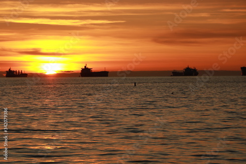 Ocean and ships during sunset