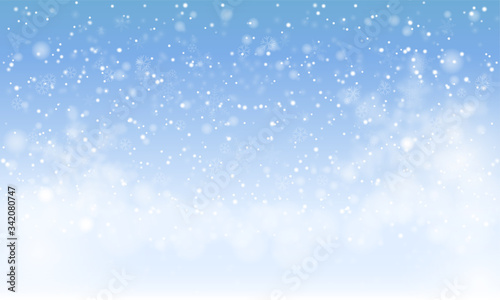 Winter snowfall and snowflakes on light blue background. Cold winter Christmas and New Year background. Vector illustration