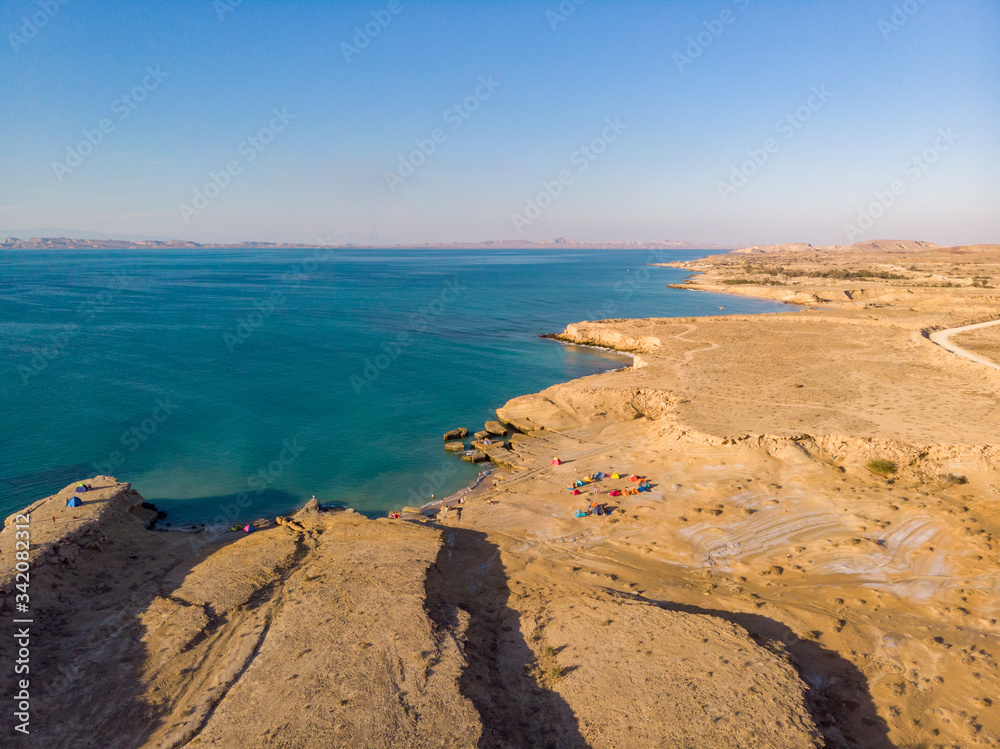 Obraz premium Aerial view of campsites near the ocean in the island of Hengam in Iran