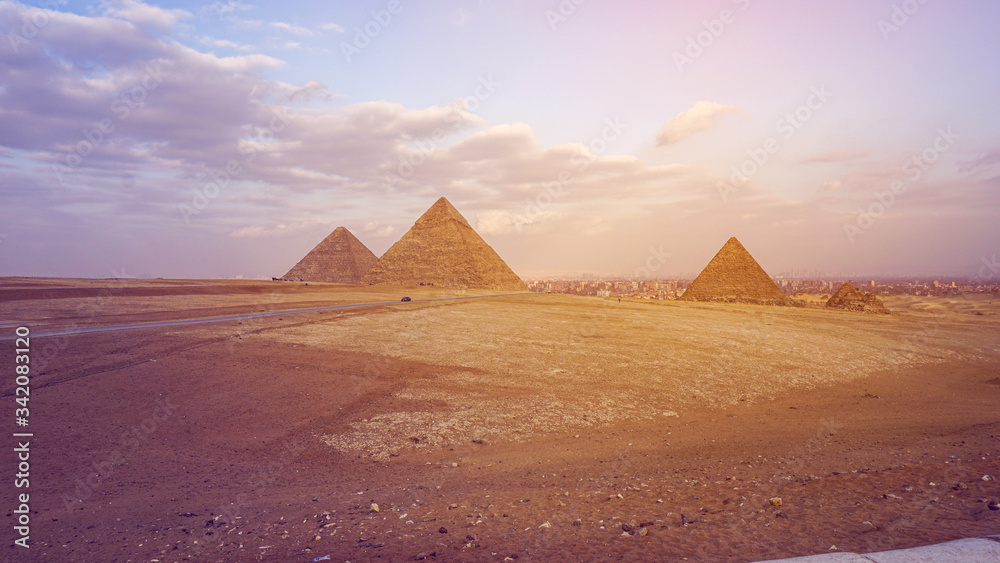 Pyramids of Giza with Giza city view background